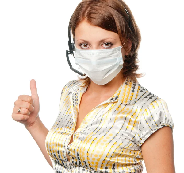 Girl in a medical mask and ear-phones with a microphone — Stock Photo, Image