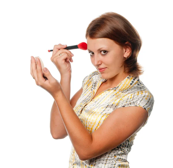 Menina faz uma maquiagem — Fotografia de Stock