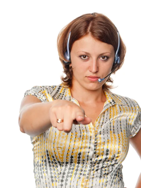 Girl with ear-phones and a microphone points a finger — Stock Photo, Image