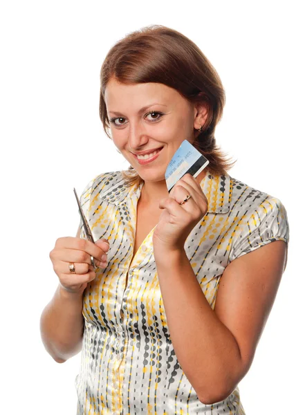 stock image Smiling girl cuts a credit card, refusal of crediting