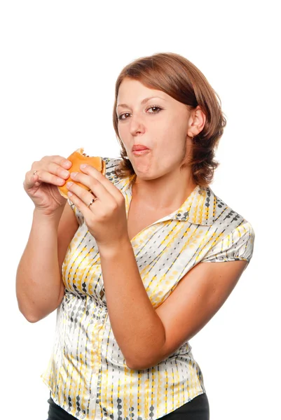 Ragazza mangia un hamburger — Foto Stock