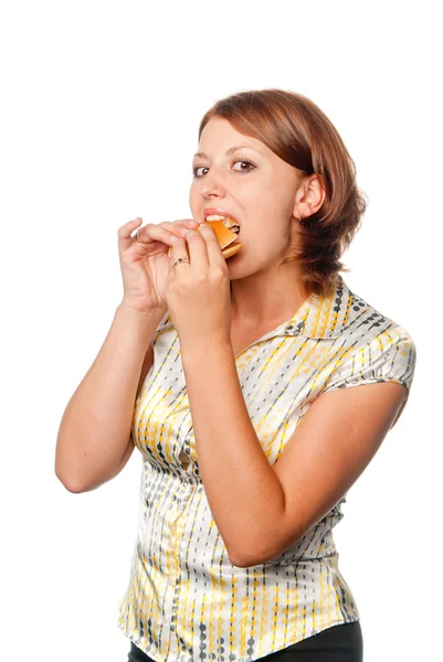女孩吃一个汉堡包 — 图库照片