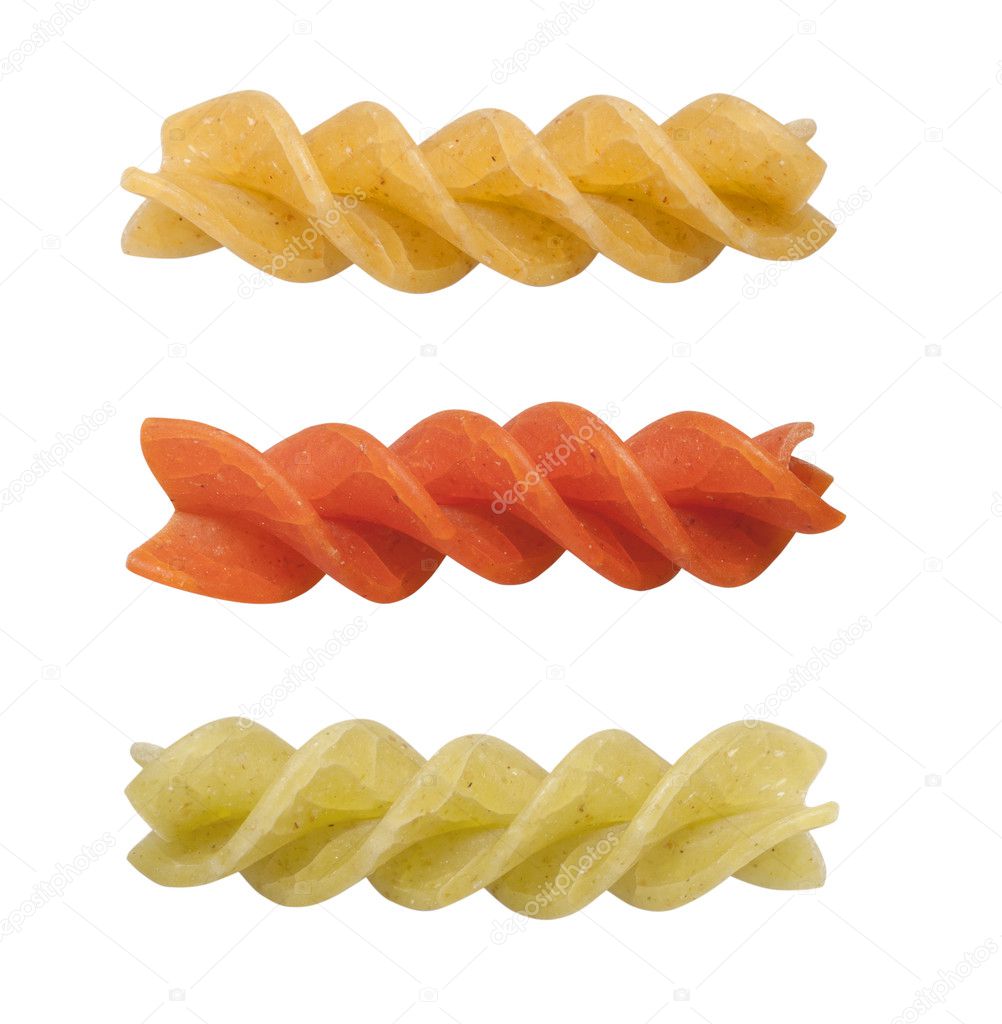 Uncooked pasta fusilli in different colours, isolated, clipping