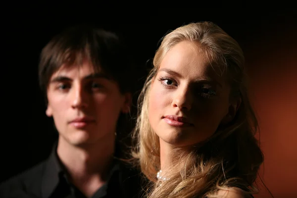 stock image Portrait of a couple in dark colours