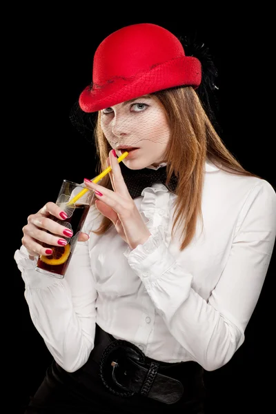 Portrait of a pretty young woman with red bonnet — Stock Photo, Image