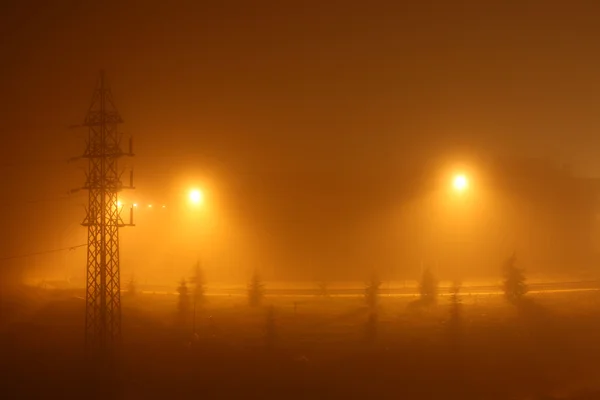 stock image Yellow background of an urban foggy night