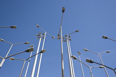 Lots of streetlamps together in perspective clipart