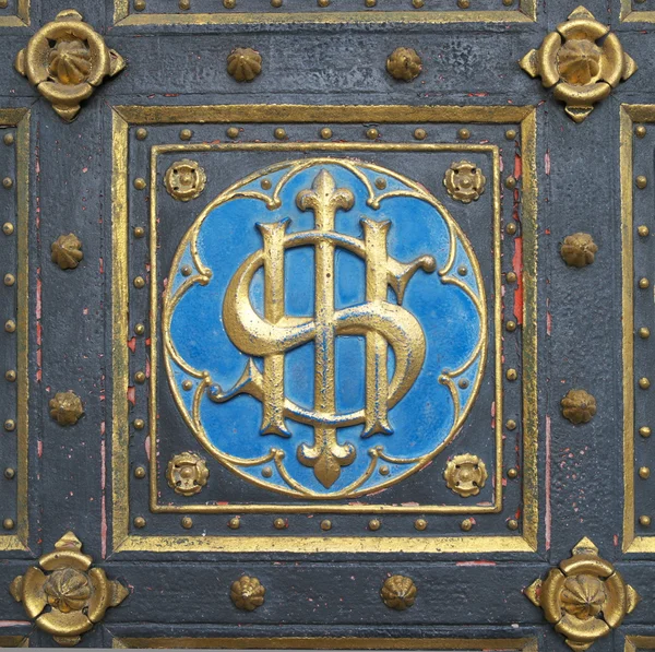 Emblem on the doors of church — Stock Photo, Image