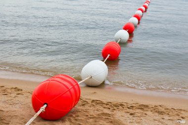 Buoy on the beach clipart