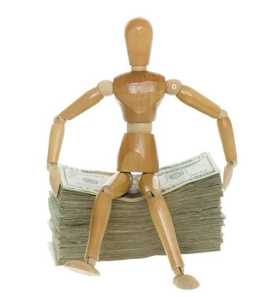 Mannequin Sitting on top of a Stack of Twenty Dollar Bills — Stock Photo, Image
