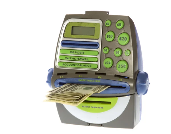 Сто долларов законопроекты, выходящие из игрушечного банкомата — стоковое фото