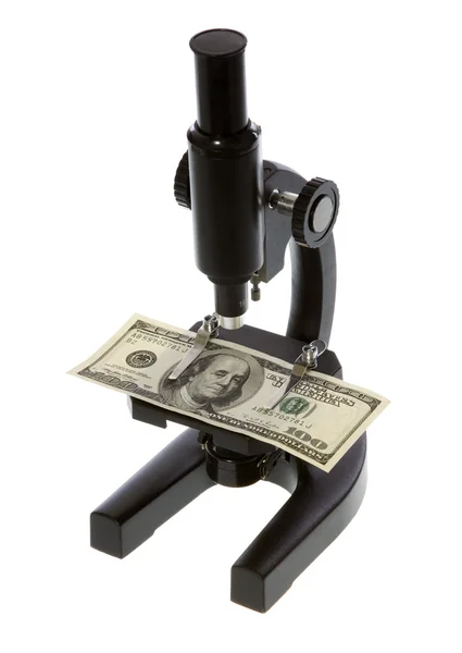 Cem Dólares Bill Sob um microscópio Imagens De Bancos De Imagens