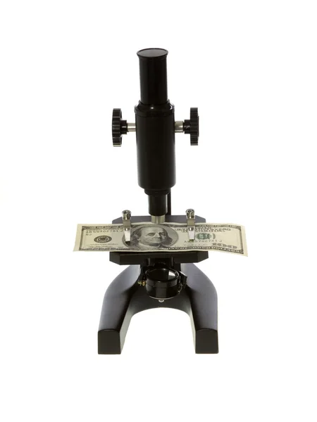 Cem Dólares Bill Sob um microscópio Fotos De Bancos De Imagens