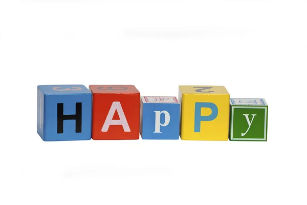 Stock image Happy written using wooden blocks