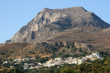 Small city near mountain in Crete clipart