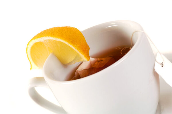 Black tea in white Cup with lemon