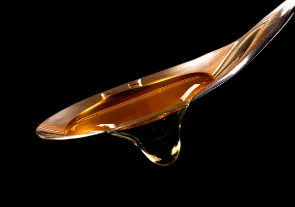 stock image Honey on a spoon