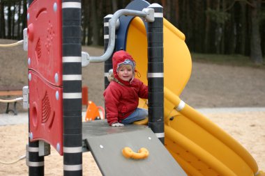 Girl playing and smiling clipart