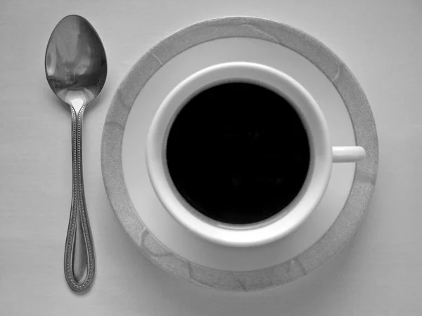 Taza de café con platillo y cuchara —  Fotos de Stock