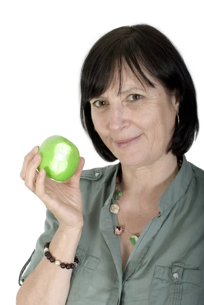 Aged woman with fresh apple — Stock Photo, Image