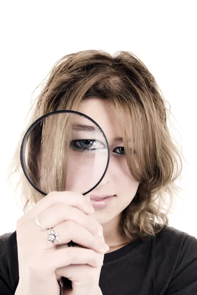 Young girl with magnifying glass — Stock Photo, Image