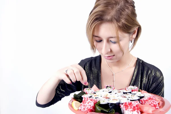 Flicka med sushi — Stockfoto