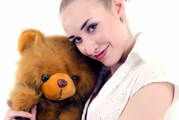 Mujer joven con oso de peluche — Foto de Stock