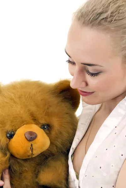 Молода жінка з плюшевим ведмедем — стокове фото