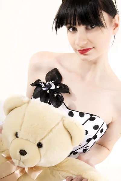 Fiatal nő teddy macival — Stock Fotó