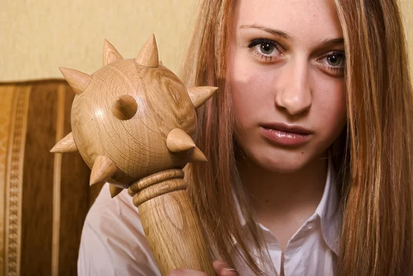 Young girl with a cudgel — Stock Photo, Image
