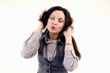 Young girl in headphones listening to music clipart