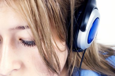 Young girl in headphones clipart