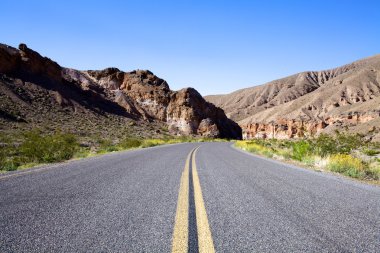 Desolate Highway into Mountains clipart