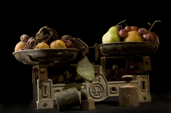 stock image Scales of Rot and Fresh fruits.