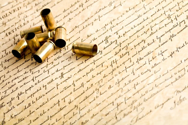 Bullet casings on bill of rights — Stock Photo, Image
