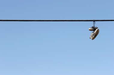 Shoes on power lines clipart