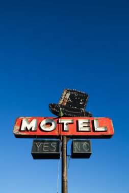 Motel sign against blue sky clipart