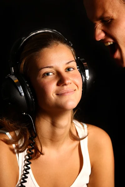 Garota menino e fones de ouvido — Fotografia de Stock