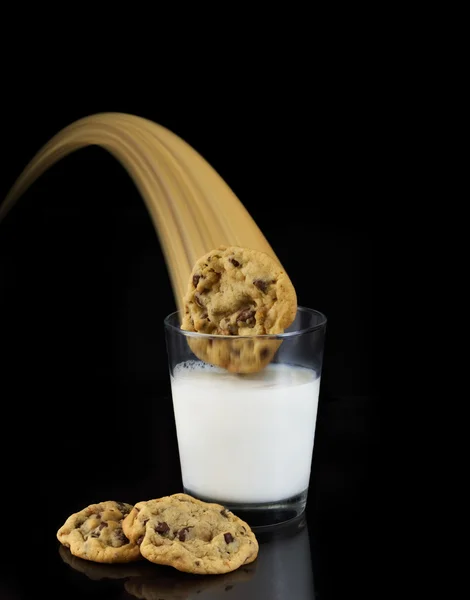 stock image Three chocolate chip cookies swoop