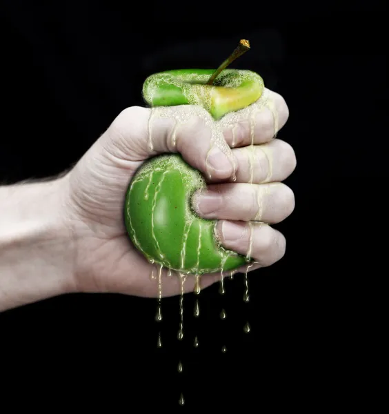 Рука и яблоко — стоковое фото