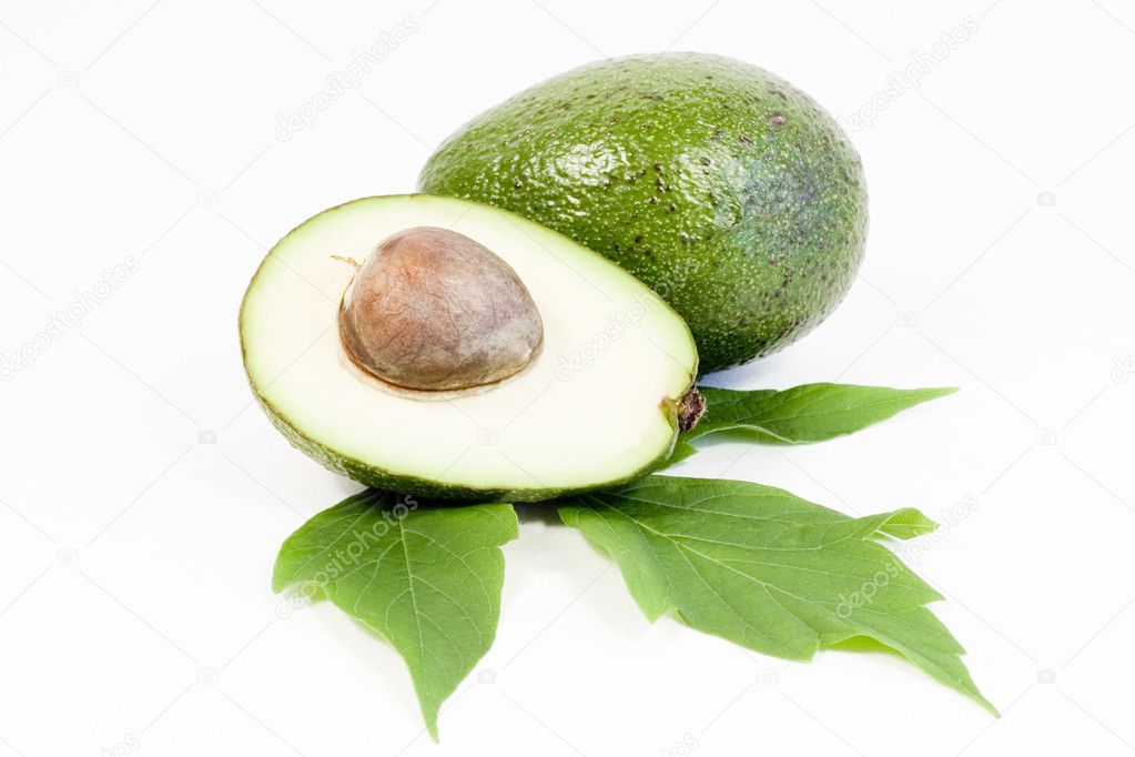 Whole and half avocados isolated on white background