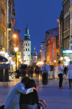 Couple on night Cracow street clipart