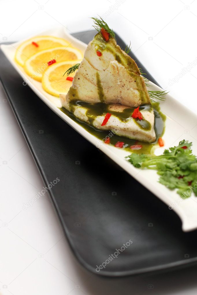 Steamed cod fish topped with special sauce