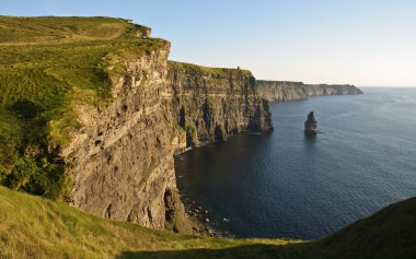 Late sunset famous irish cliffs of moher clipart