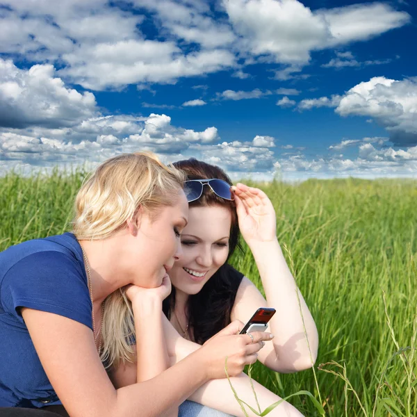 stock image Two women reading sms