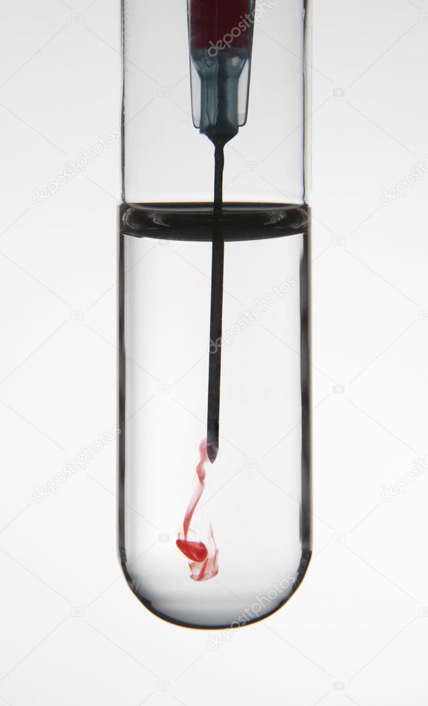 Test tube and syringe with hypodermic needle