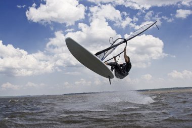 Windsurfer flying in the air clipart