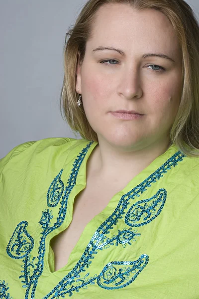 Overweight woman looking sad — Stock Photo, Image