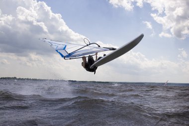 Windsurfer doing a nose landing