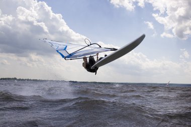 Windsurfer doing a nose landing clipart